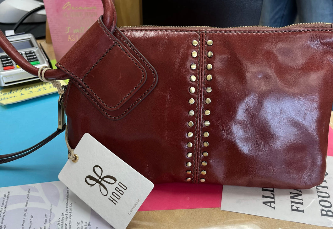 Hobo wristlet with brass detailing